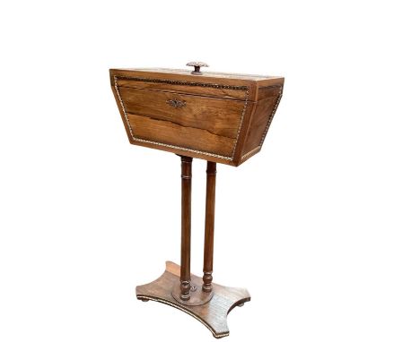 Regency rosewood Teapoy on three column supports and quatrefoil base