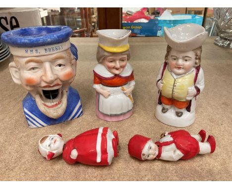 Group of late 19th/early 20th century German bisque figures including a novelty ashtray named to HMS Breezy and a pair of min