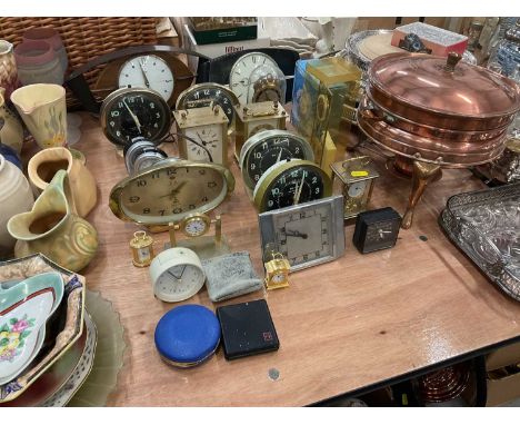 Group of assorted clocks to include Metamec clock, carriage clocks and others.