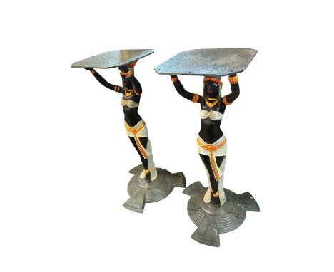 Pair of Art Deco style cast iron table pedestals, with Egyptian figural supports on stepped spread base, 71cm high