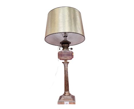 Early 20th century silver plated Corinthian column oil lamp, converted to electricity.There are no signs of inscriptions or d