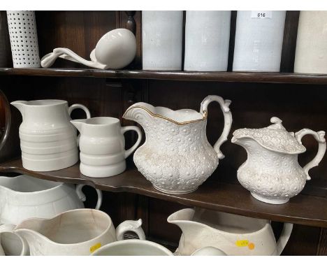 Group of four 19th century and later white glazed ceramic jugs (4).