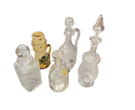 Group of antique glass decanters and a water carafe.