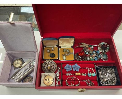 Two jewellery boxes containing costume jewellery, 9ct gold back and front locket, Miracle brooches, silver and a vintage Cert