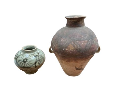 Chinese pottery vessel with geometric pattern and lug handles, possibly Neolithic, 32cm high, and a smaller black painted vas
