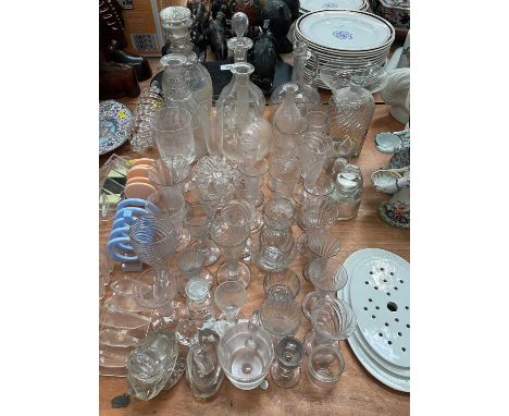 Collection of antique glassware to include decanters, wrythen glasses and others.