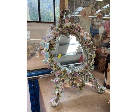 Antique Dresden porcelain mirror, with floral encrusted and figural decoration, 52cm highNumerous losses/chips. Please see ad