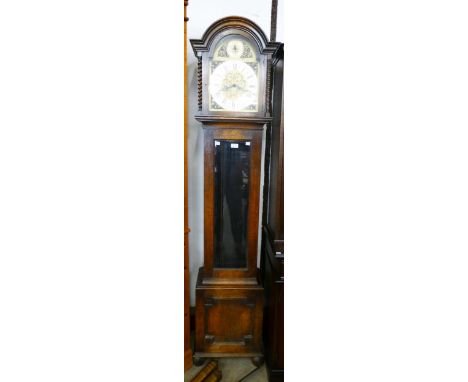 An early 20th Century oak triple weight longcase clock 