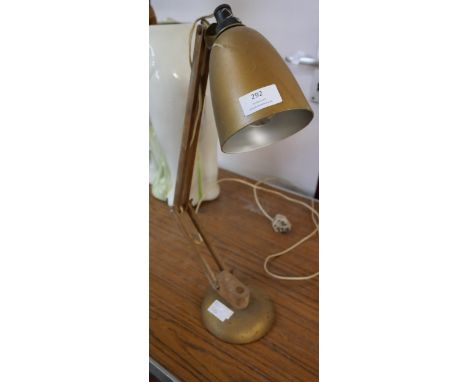 A wooden and metal anglepoise lamp 