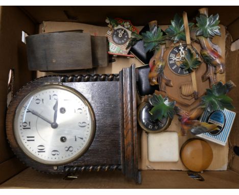 An early 20th Century oak mantel clock, a cuckoo clock, etc.