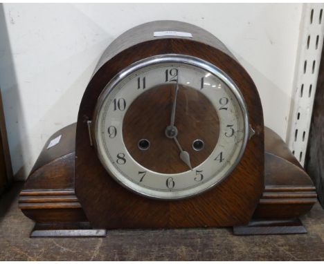 An oak mantel clock 