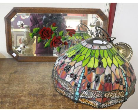 A Tiffany style light shade and a gypsy's mirror