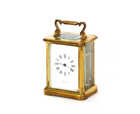 A brass cased carriage clock, retailed by Mappin & Webb having white enamel Roman numeral dial, angular swing handle, 14cm hi