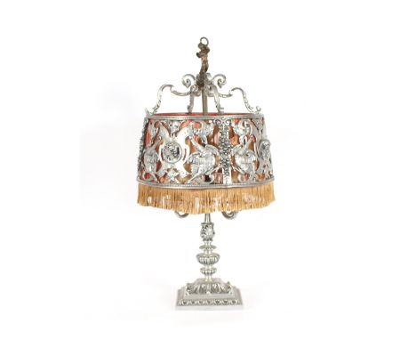 A large aluminium table lamp, with ornate silk lined shade, circa 1920's