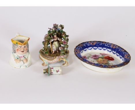 A small Victorian porcelain Toby jug; a Dresden taper stick, AF; and a small oval floral decorated shallow dish, AF, (3)