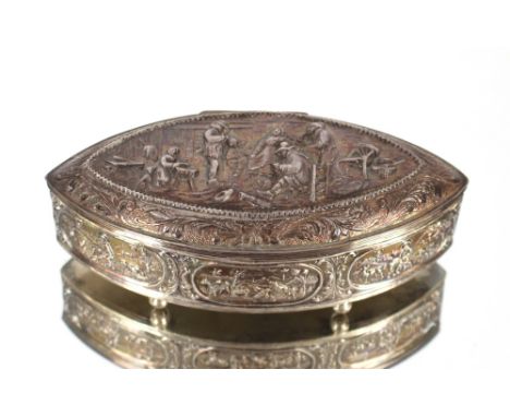 A Continental white metal trinket box, of navette shape, the lid embossed with merrymaking figures in a tavern interior and c