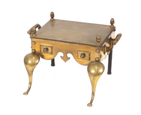 A George III brass and steel footman, raised on cabriole front supports, flanked by turned carrying handles, with acorn finia