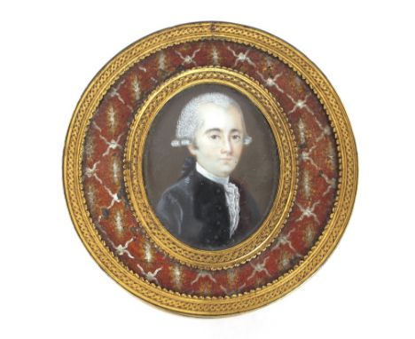 A 19th Century circular tortoise shell and gilt metal mounted box and cover, the lid decorated with a miniature portrait of a