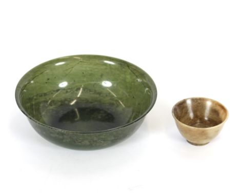 A spinach green jade bowl, 13.5cm dia.; and a small grey hardstone bowl, 5.5cm dia., (2)