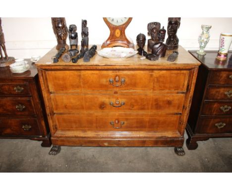 A 19th Century Continental walnut boxwood and satinwood strung commode chest, fitted three long graduated drawers, raised on 