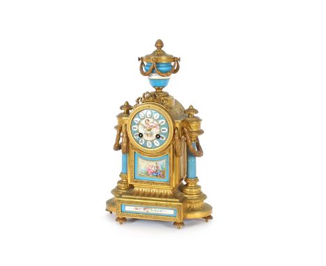 A 19th Century ormolu and Sevres style porcelain mounted mantel clock, stamped to the reverse "Phillipe Mourey", the circular