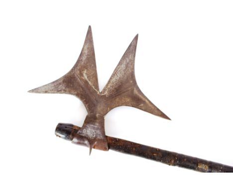 An old leather shield, decorated with four raised brass bosses; an axe with leather bound handle and an ethnic wooden club, 5