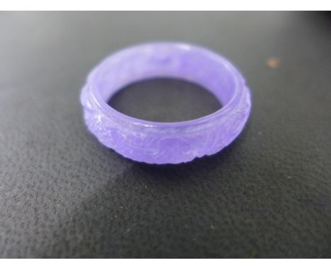 A carved jade dragon ring size Y - no obvious damage