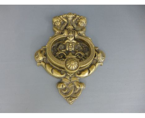 A brass door knocker - 26cm x 19cm Condition report: Some usage 