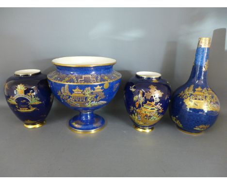 Four items of Carltonware all with blue fields decorated in gilt with Oriental scenes, one large bowl on single pedestal, two