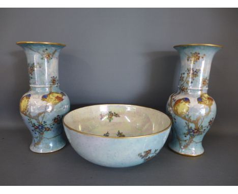 A pair of light blue lustre finish Carltonware vases and a bowl all decorated with birds perched on flowering branches, vases