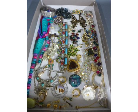 A large collection of vintage costume jewellery including silver brooch, micro-mosaic bracelet, multicoloured paste earrings,