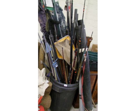 A large quantity of vintage and more recent fishing rods: nets, rests etc. 