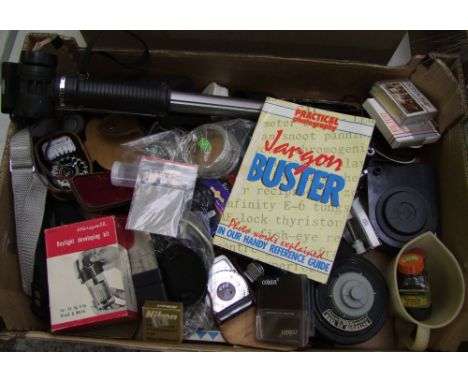 A collection of vintage camera accessories: Ambassador exposure meter, filters, batteries etc (1 tray). 