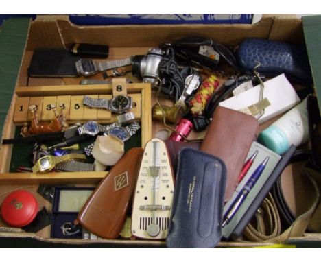 A mixed collection of items: Orient vintage watch, Sekonda ladies watch, Lorus watch, vintage plastic metronome etc (1 tray).