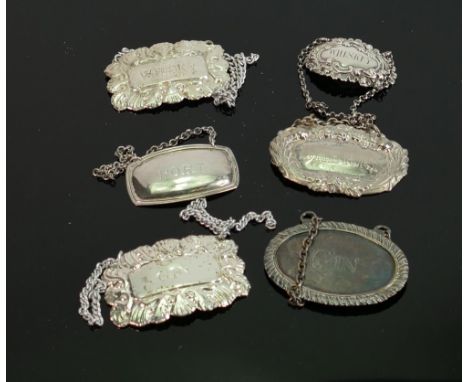 A collection of Spirit Decanter Labels: one silver item noted 