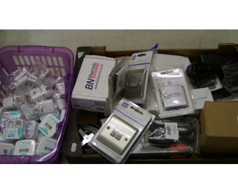 A mixed collection of electrical items: light switches, USB cables, control switches etc. 