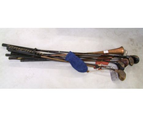 A collection of vintage golf clubs: together with a copper hunting type horn. 