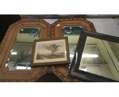 A pair of oak framed vintage wall mirrors: octagonal in form, 83cm x 53cm, plus an Art Nouveau metal framed wall mirror and a