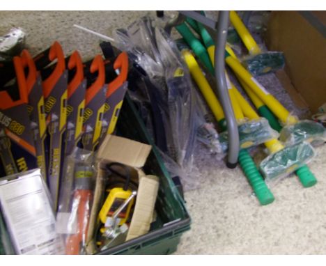 A mixed collection of tools: saws, pick axe heads, sledge hammers etc. 
