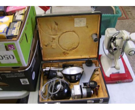 A Missouri branded vintage film projector: together with a USSR photographic enlarger and a large quantity of bulbs.: 