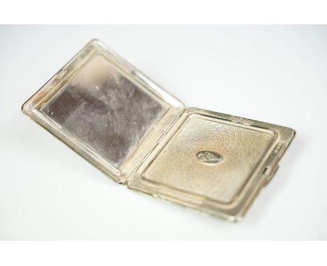A sterling silver compact by Kigu, square shape with engine turned decoration, 146g