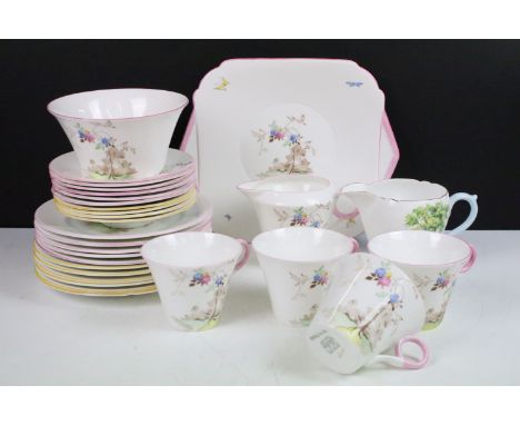 Shelley tea set with pastel floral design to include four tea cups, 6 pink rim saucers, four yellow rim saucers, five pink an
