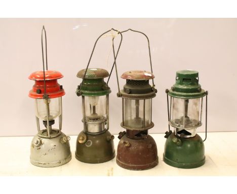 Four vintage paraffin lamps lanterns, Bialaddin model 315, one MCSU example etc
