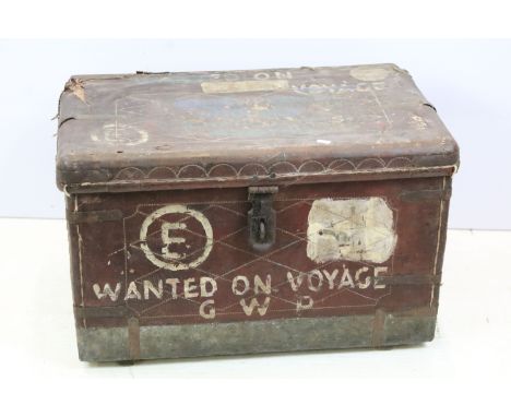 Early 20th century leather bound trunk, variously painted to include ' Wanted on Voyage GWP ', 43.5cm high x 69cm wide x 41cm