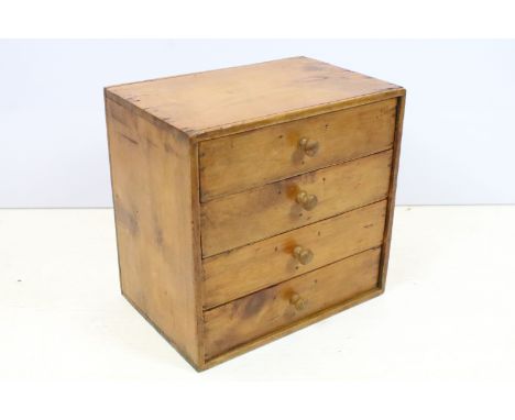 Vintage table top pine chest of four long drawers 