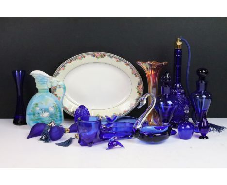 Selection of blue glass decorative items to include atomiser perfume bottle, scent bottles, swan, pipe, four frosted shell de