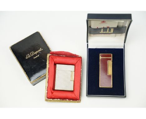 An S.T. Dupont short diamond head gas roller lighter, stamped BMO 419, in original box with manual together with a Dunhill ro