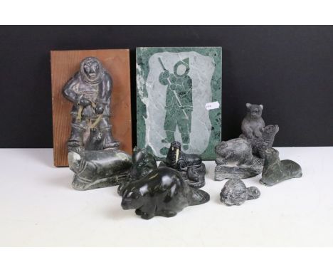 Selection of Eskimo art to include Al Wolf inuit hunter soapstone vintage wall hanging, selection of animals, and carved wall
