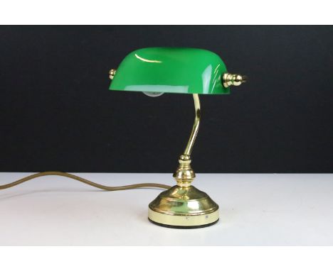 Banker’s style desk lamp of small proportions with green glass adjustable shade and gilt base, 23cm high