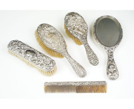 Antique dressing table set of silver ornate embossed hairbrushes and comb together with silver plated vanity mirror and cloth